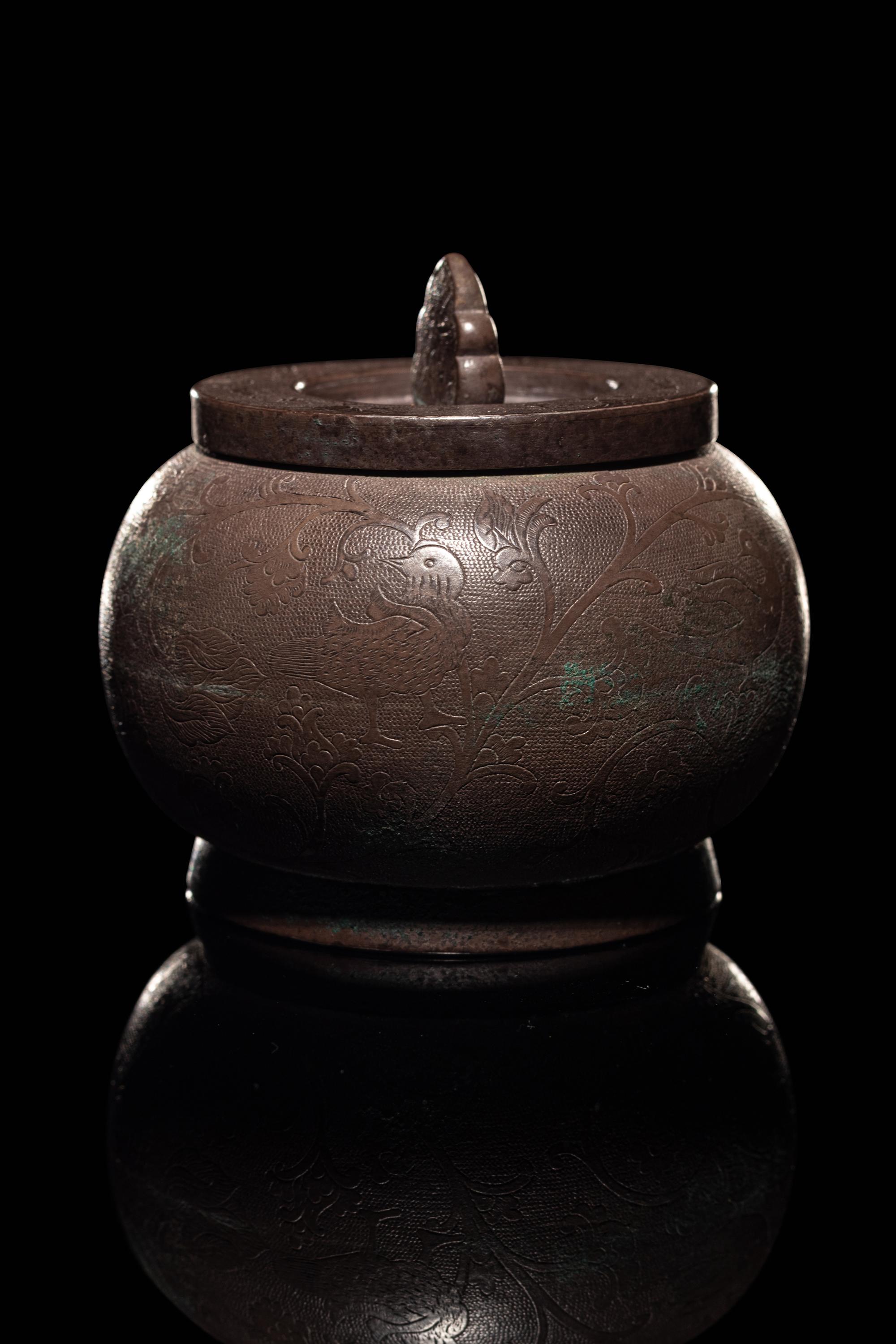 An Incised Silver Covered Jar