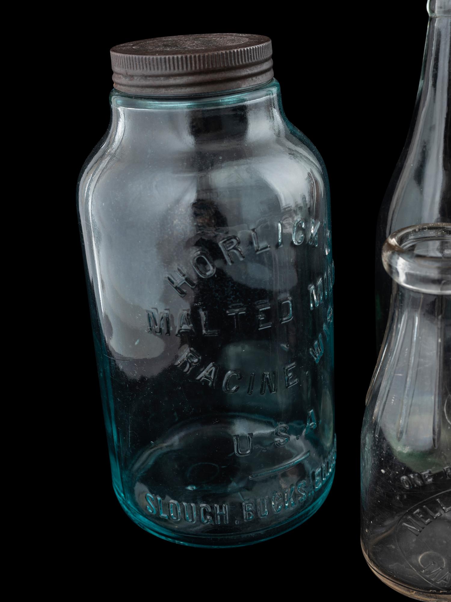 Sixteen Glass Advertising Bottles