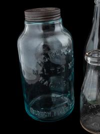 Sixteen Glass Advertising Bottles