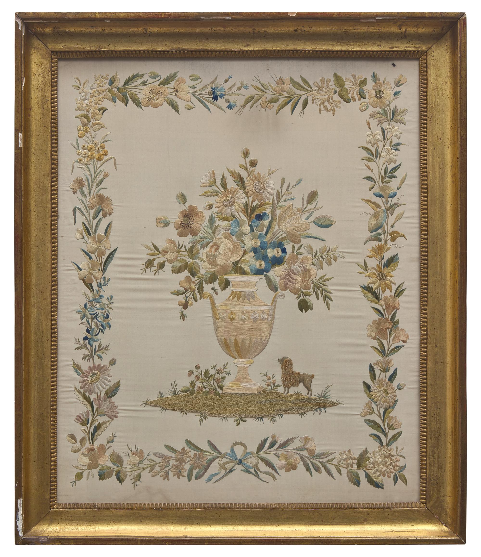 An English Regency Embroidered Silkwork Picture of a Floral Urn with Poodle