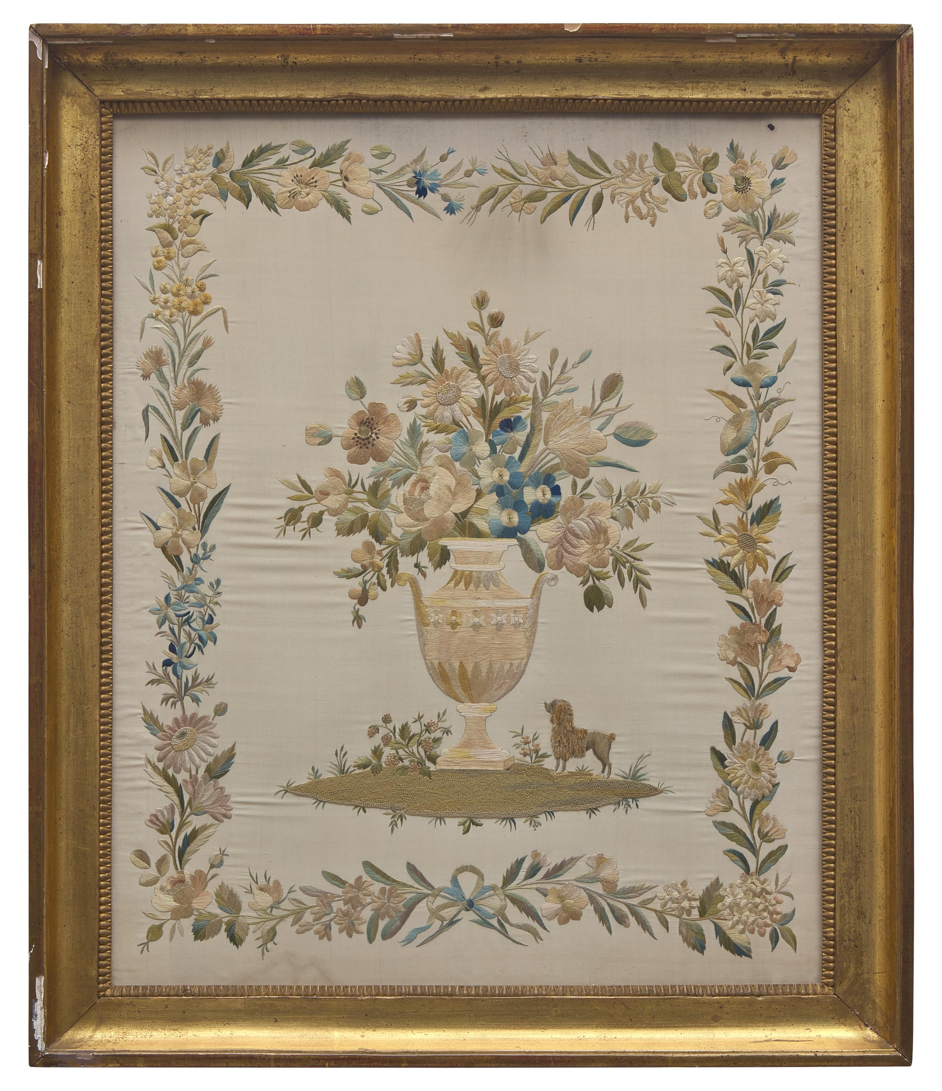 An English Regency Embroidered Silkwork Picture of a Floral Urn with Poodle