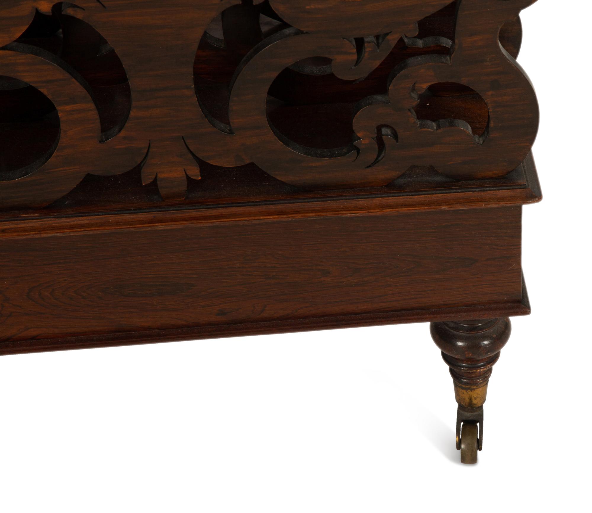 A Late Regency Carved Mahogany Canterbury