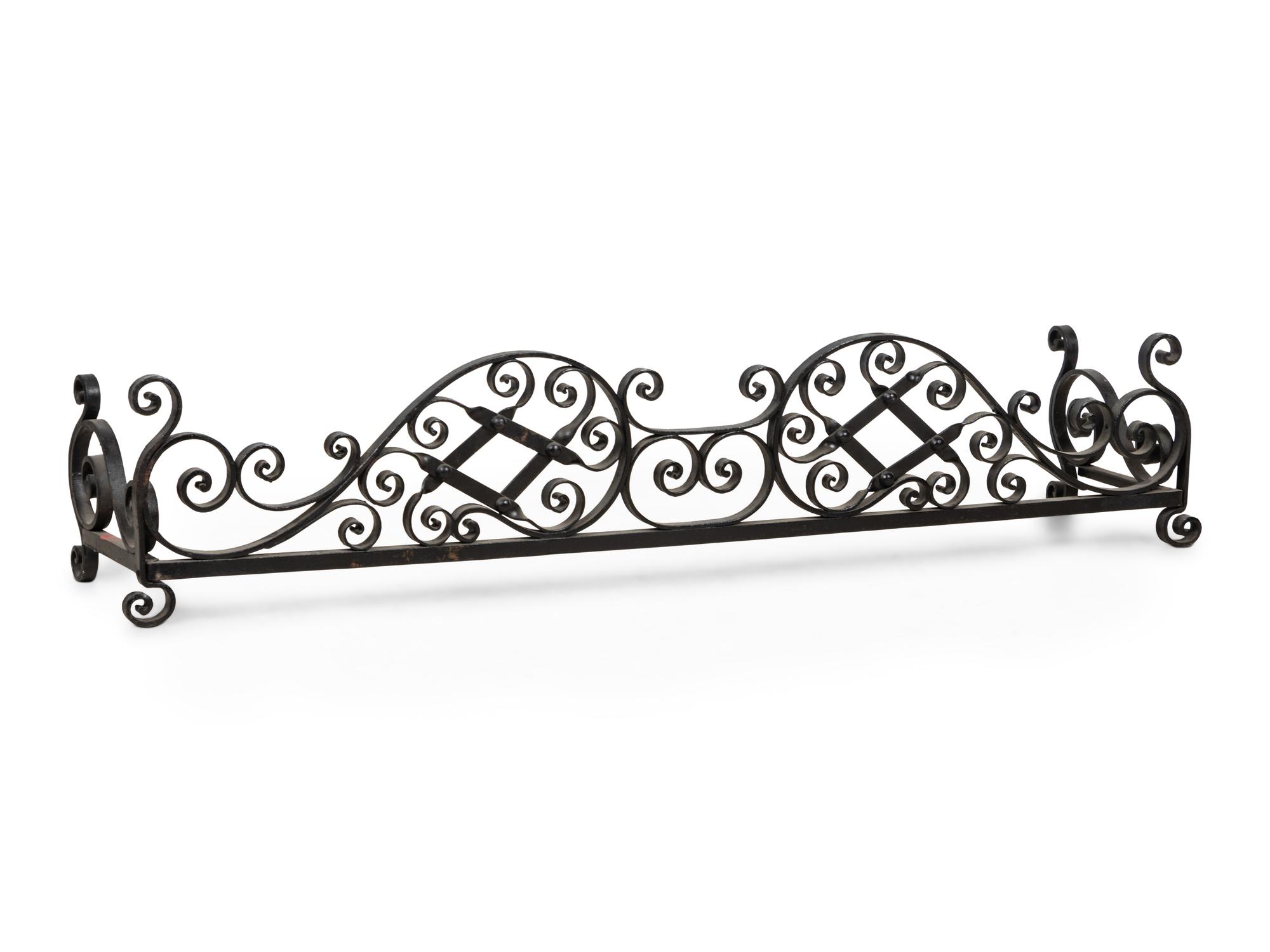 A Wrought Iron Fireplace Fender