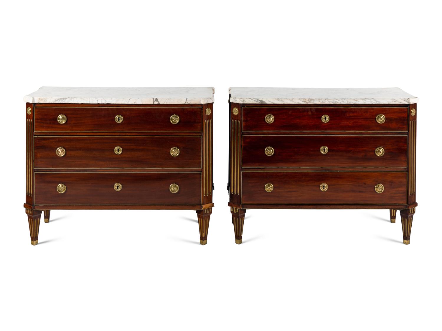 A Pair of Swedish Neoclassical Gilt Metal Mounted Mahogany Marble-Top Commodes