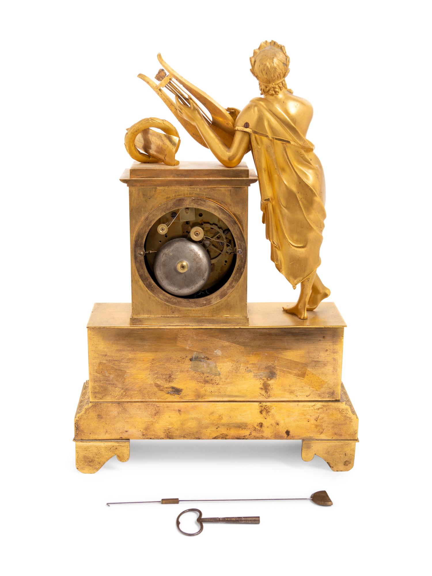 An Empire Gilt Bronze Figural Mantel Clock