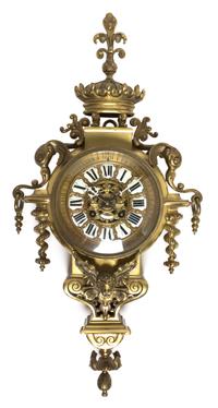 A Neoclassical Brass Cartel Clock, Height 21 inches.
