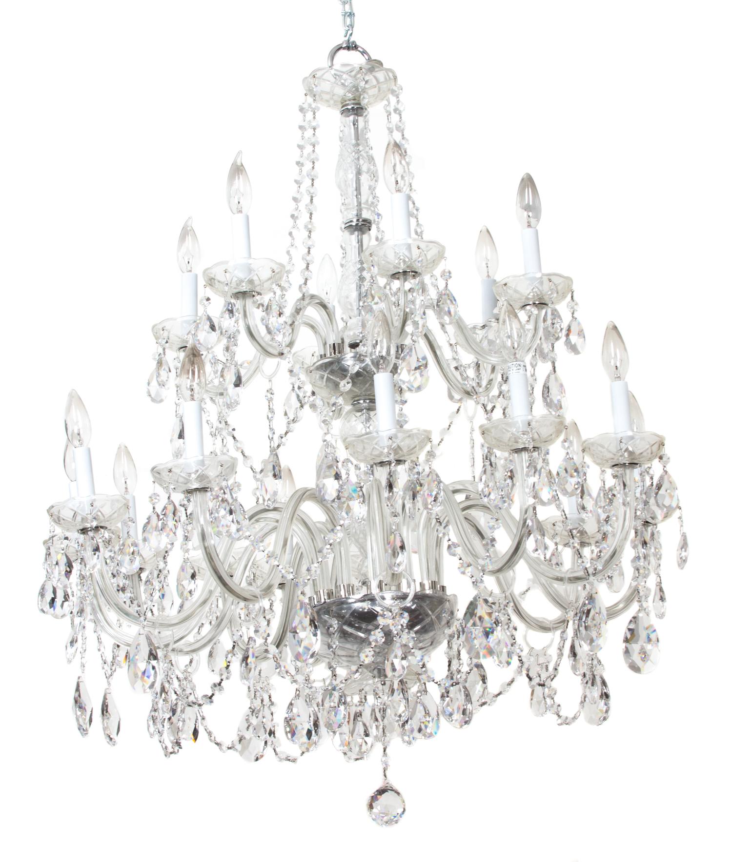 A Cut Glass Eighteen Light Chandelier Height 41 x diameter 32 inches. — 20TH CENTURY