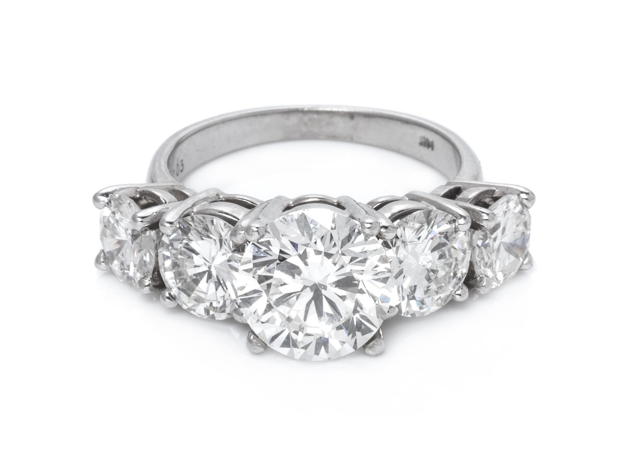 A 14 Karat White Gold and Diamond Ring,