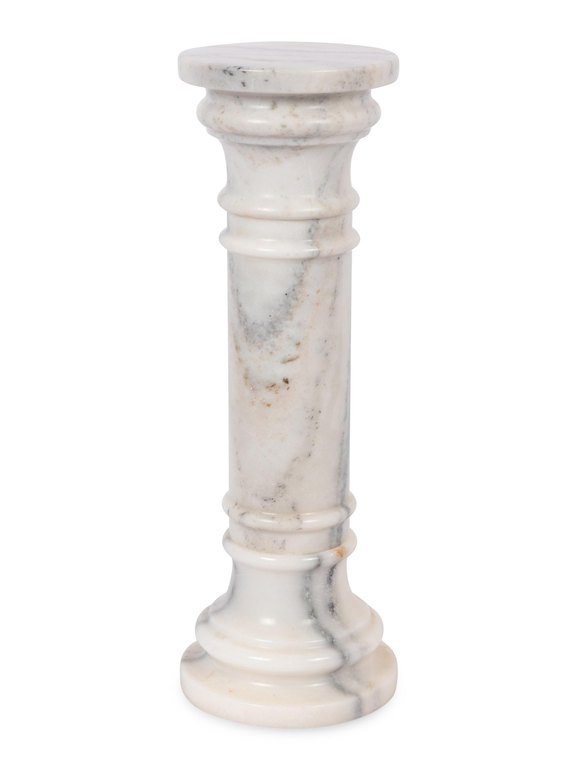 A Pair of Continental Carved Marble Pedestals