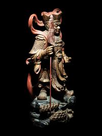 A Set of Four Gilt and Red Lacquered Wood Figures of Guardians