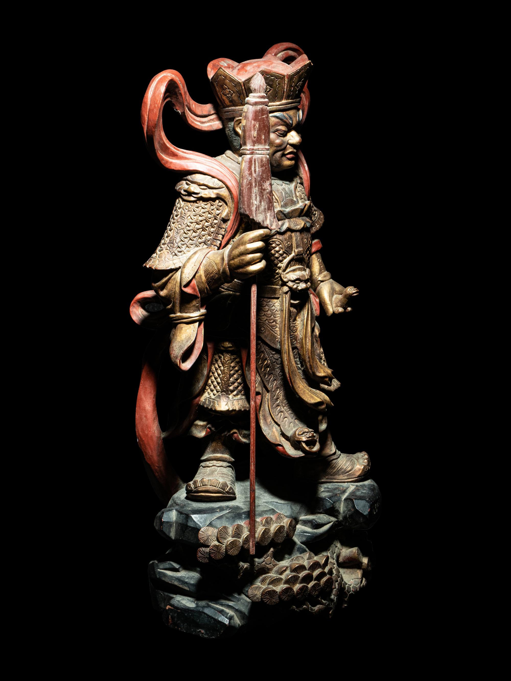 A Set of Four Gilt and Red Lacquered Wood Figures of Guardians