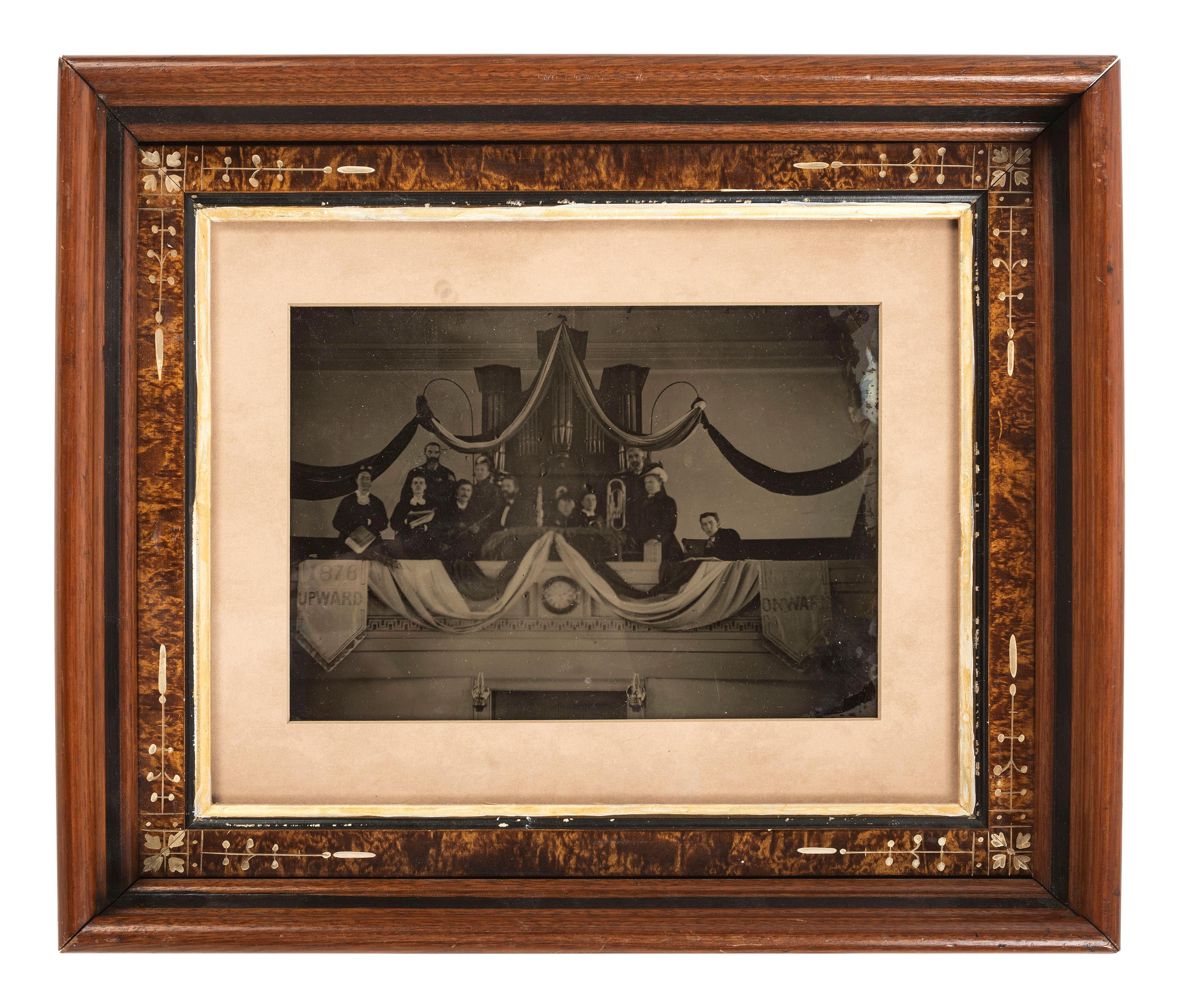 Ambrotypes Upward / Onward . Whole plate ambrotype of a musical group, likely a church band, posed in front of an organ. Ca 1876.