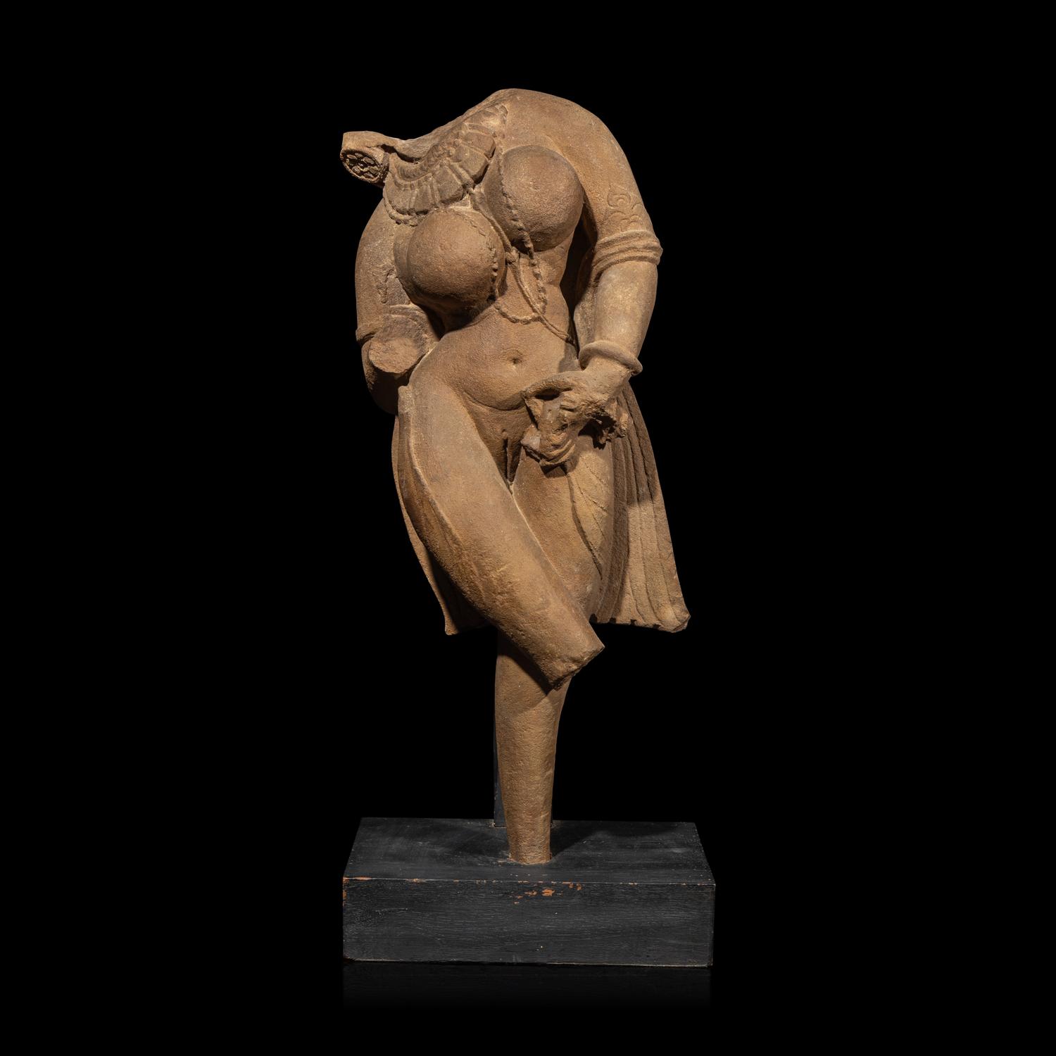 An Indian Sandstone Torso of a Goddess, 12th Century 十二世紀 印度砂岩女神像