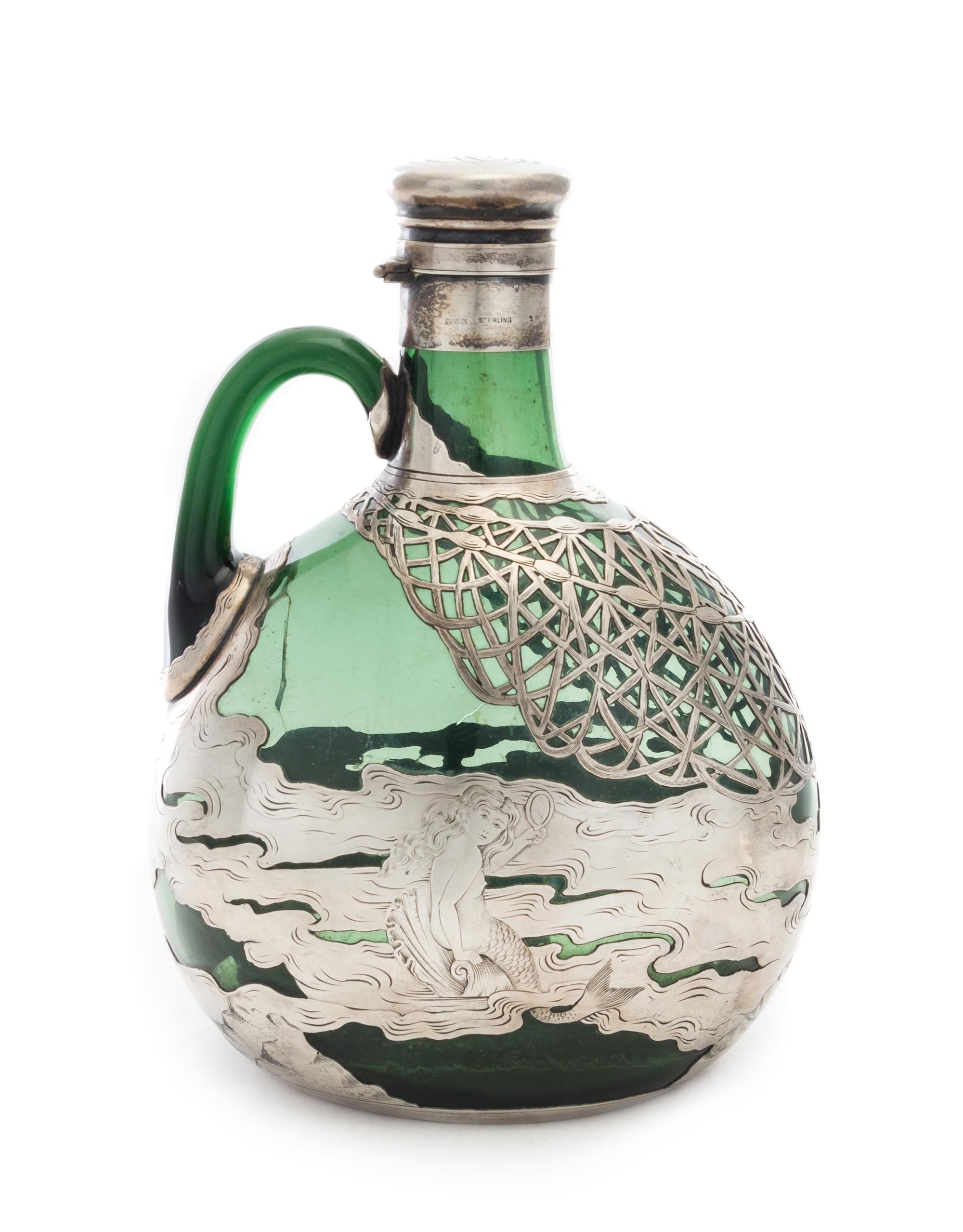 An American Silver Overlaid Glass Bottle, Gorham Mfg. Co., Providence, RI, 19th Century, one side worked to show a mermaid on rockery,