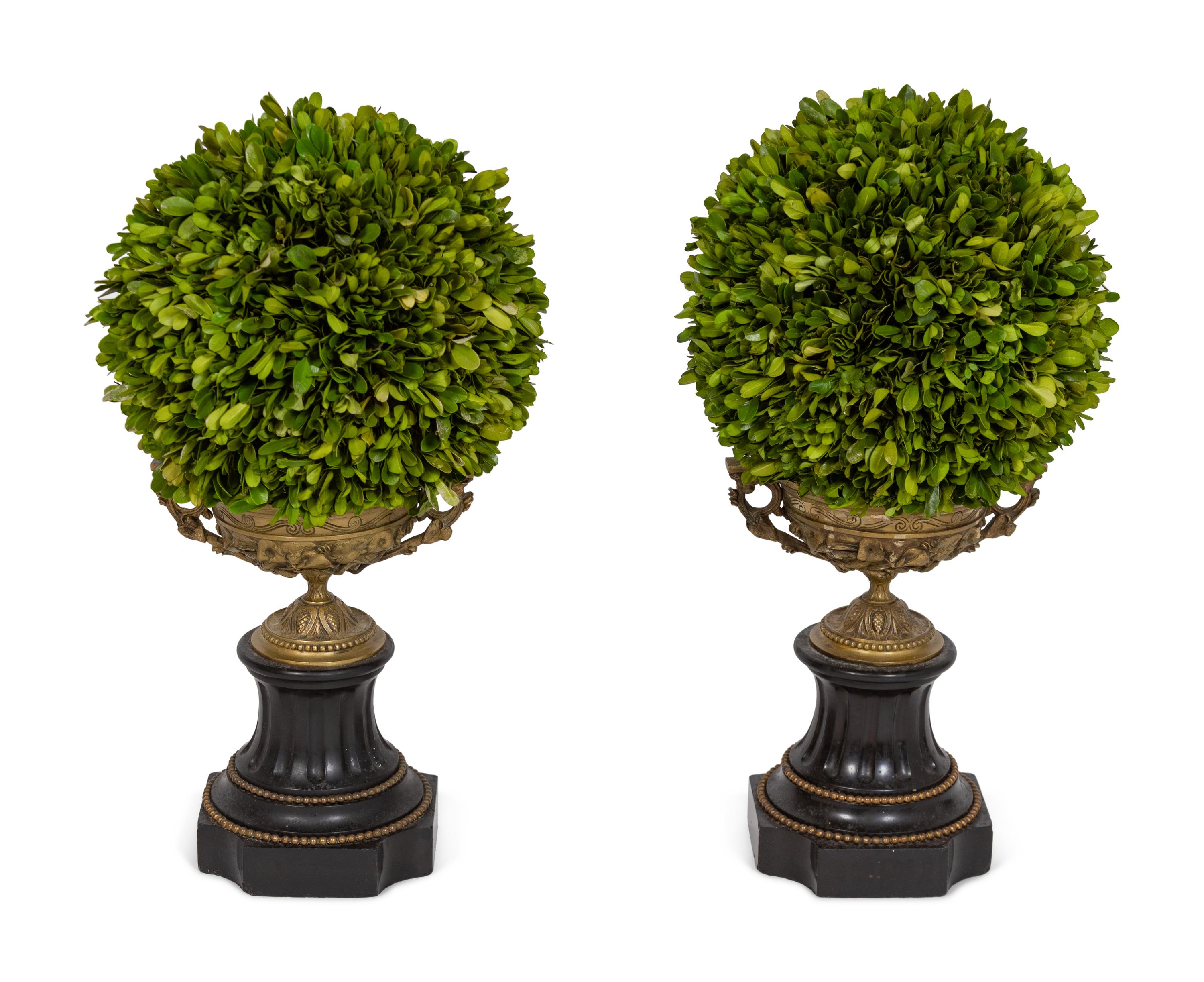A Pair of Gilt Metal Urns with Faux Topiaries