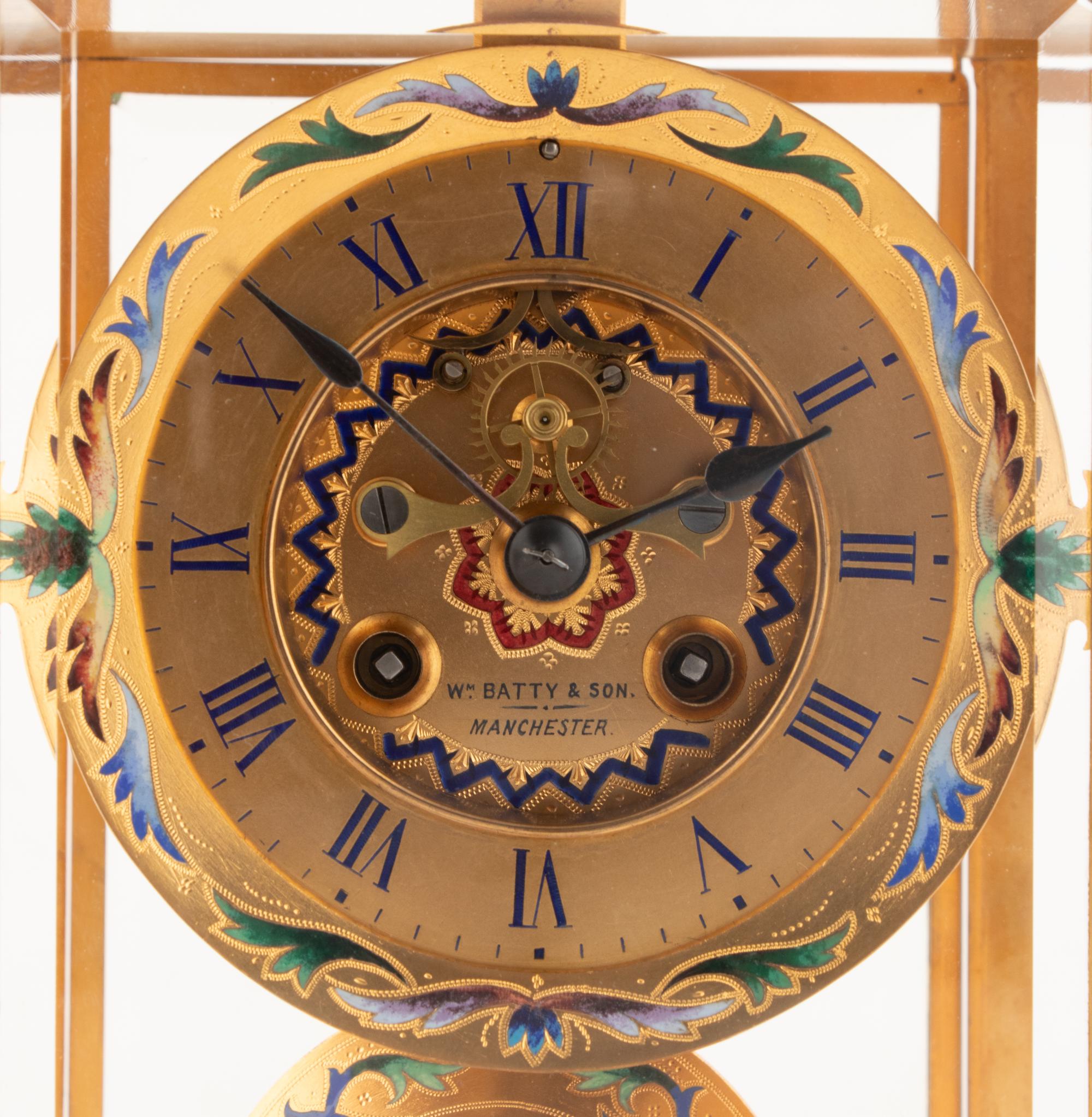 An English Champlevé Enamel and Gilt Bronze Clock Garniture