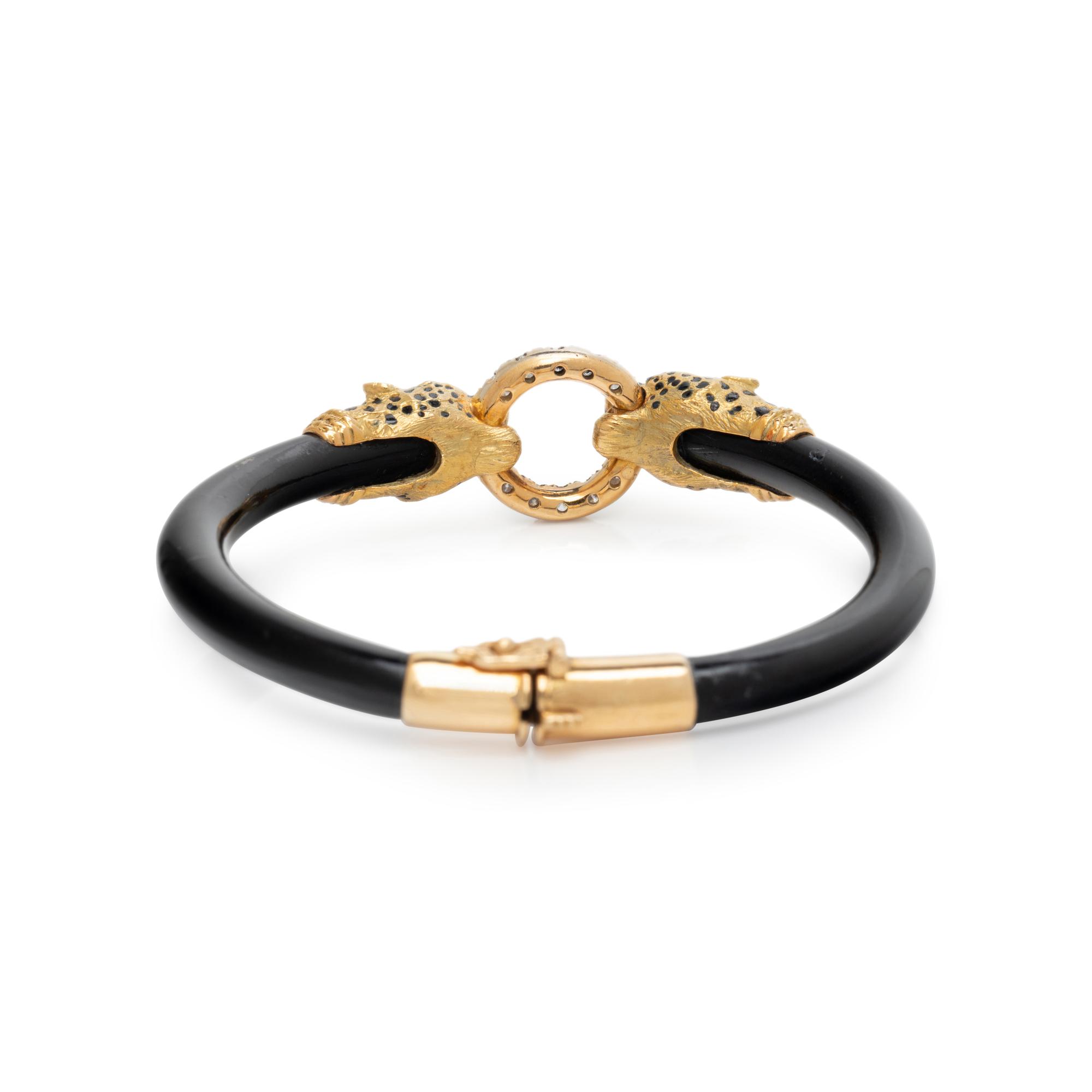 YELLOW GOLD, DIAMOND, AND ENAMEL PANTHER HEAD BANGLE BRACELET