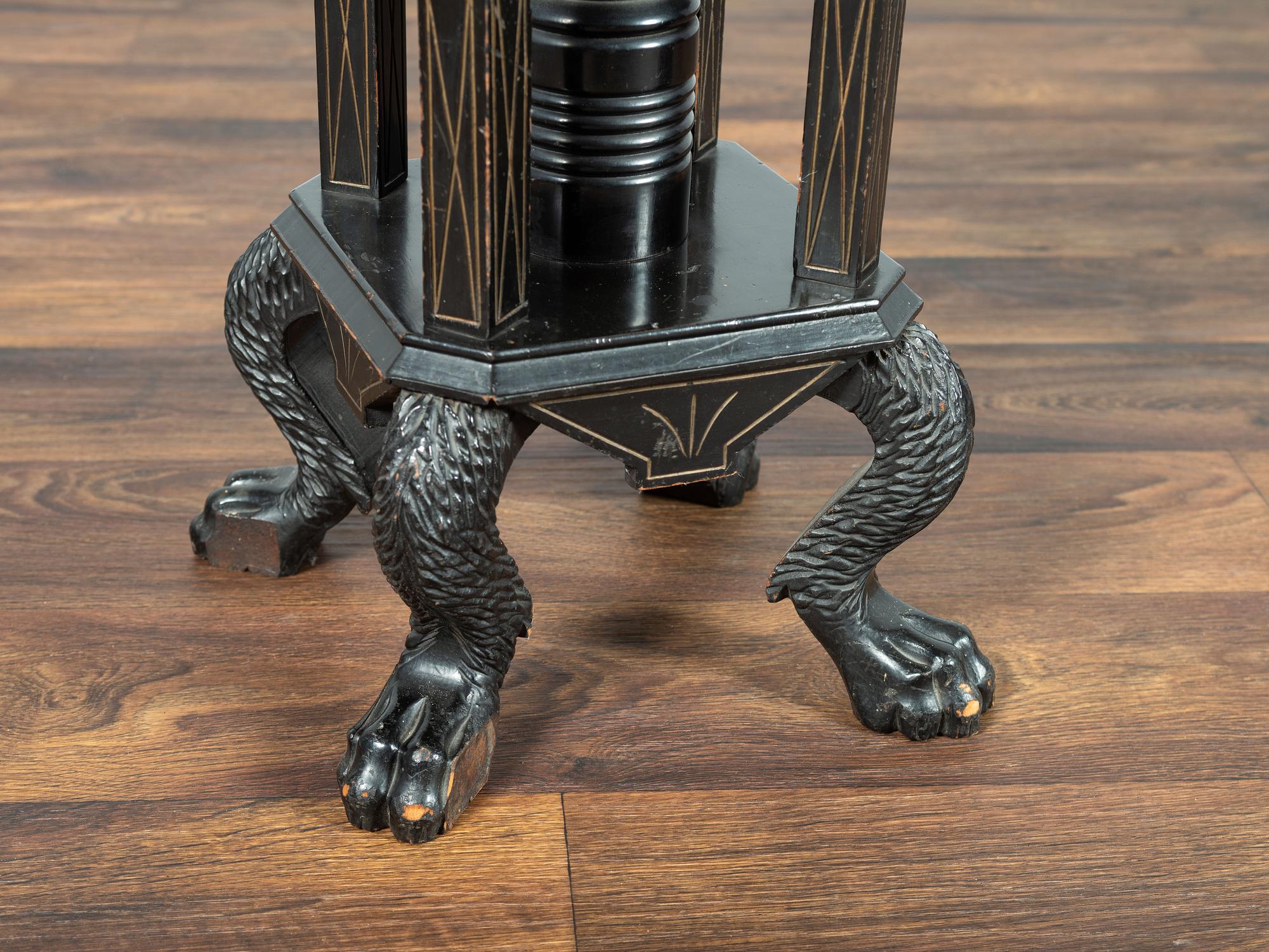 A Victorian Marble-Top Carved and Ebonized Parlor Table with Dog