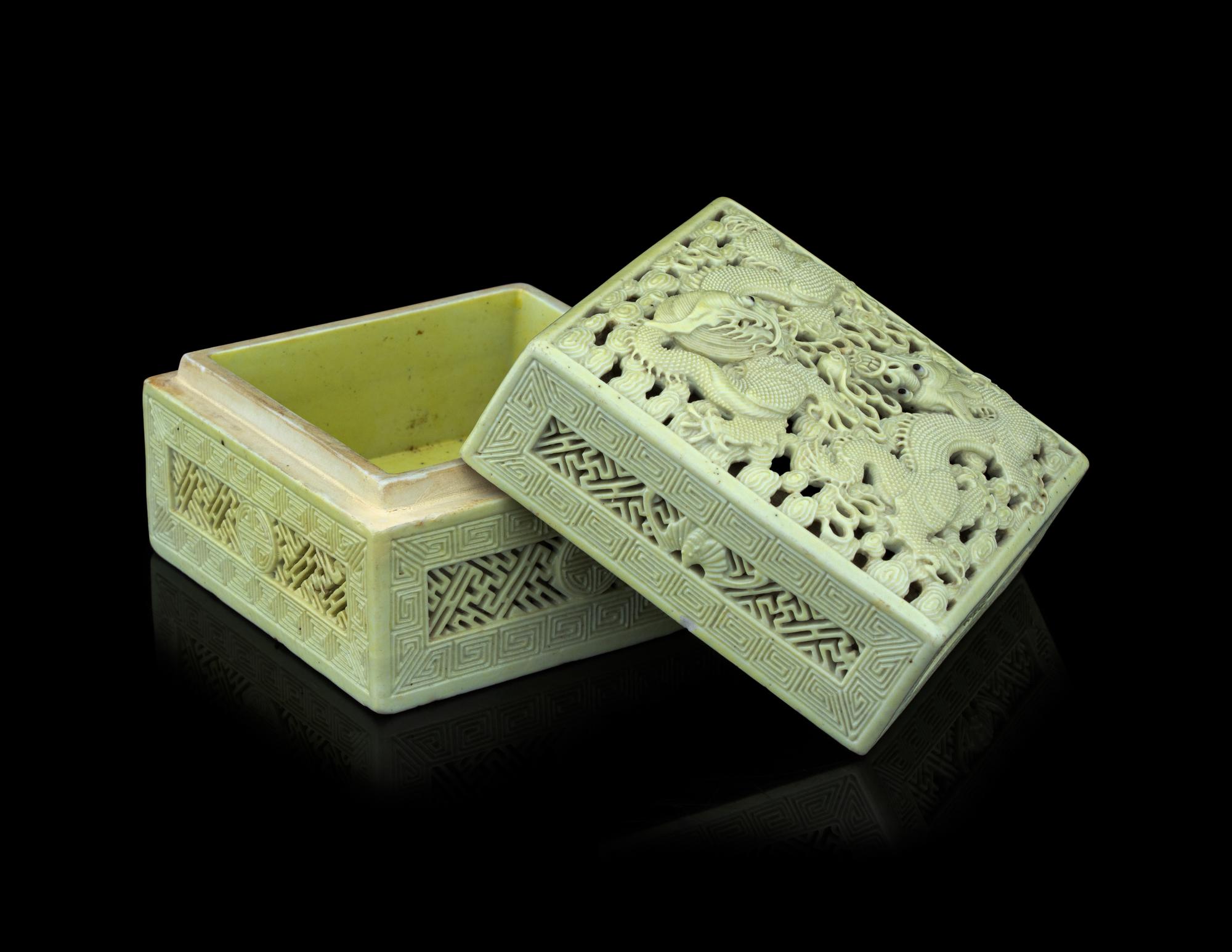 A Carved and Molded Pale Lime Glazed Porcelain 'Dragons' Seal Paste Box and Cover