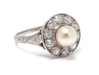 An Edwardian Platinum, Pearl and Diamond Ring, 3.20 dwts.