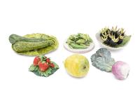 A Collection of Eleven Assorted Ceramic Fruit and Vegetable Articles in the Style of Eva Gordon