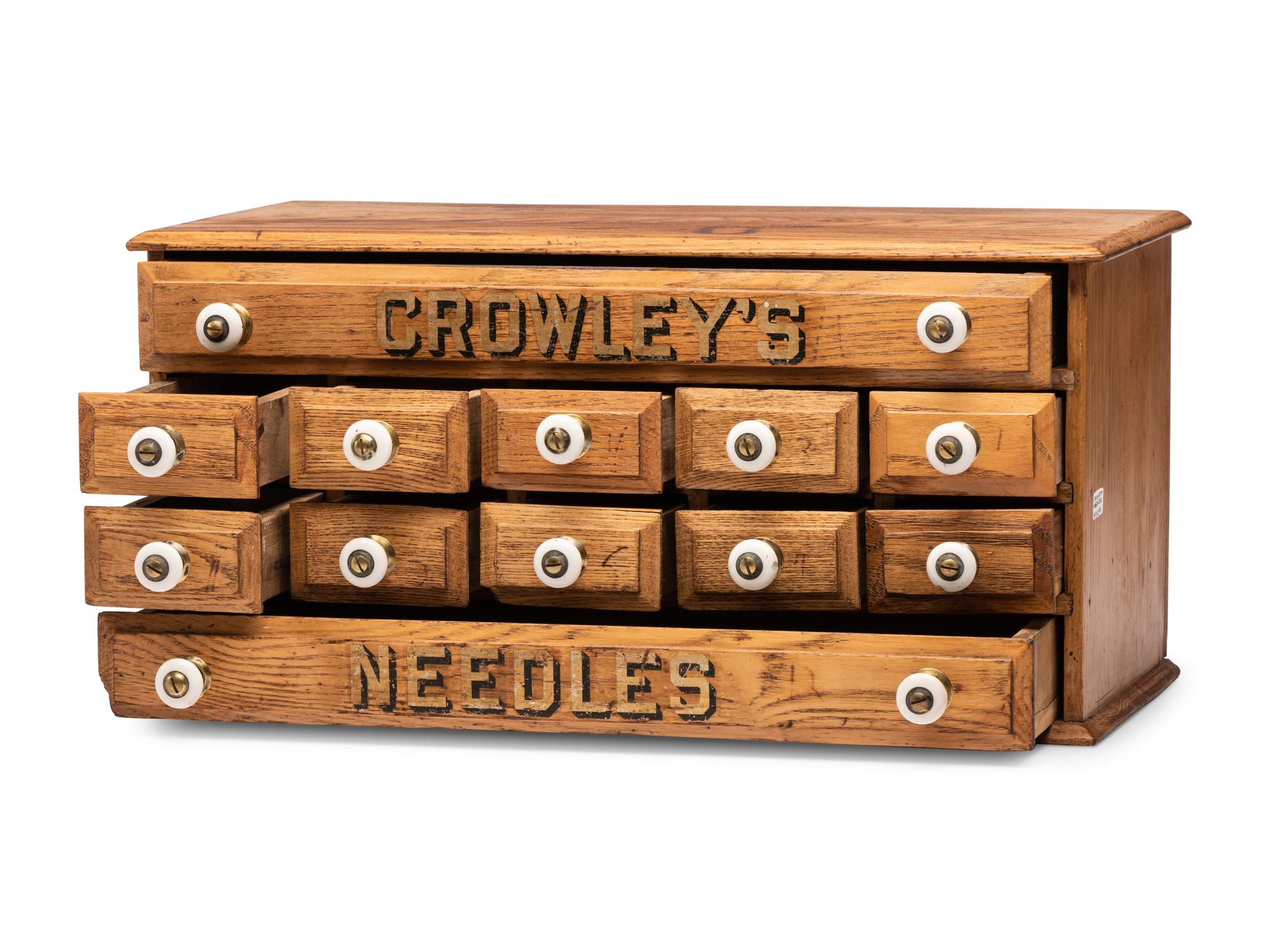 A Twelve Drawer Crowley's Needles Advertising Cabinet
