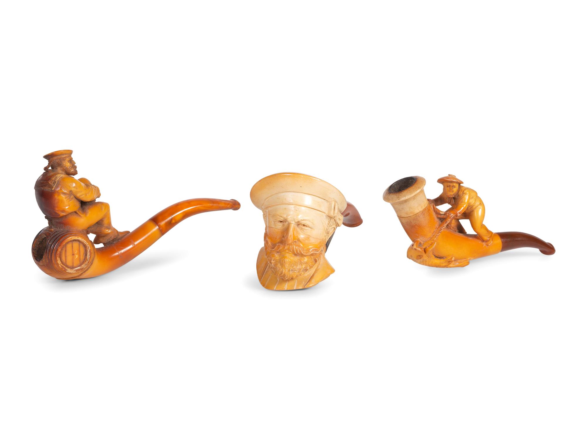 Three Carved Meerschaum Figural Pipes