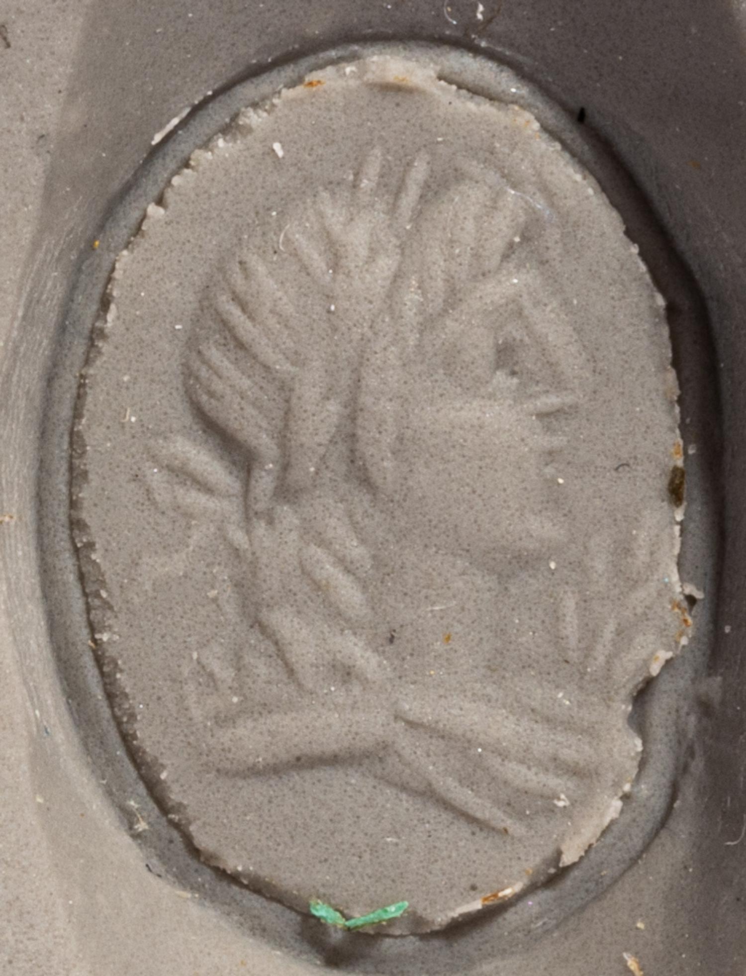 A Roman Gold and Carnelian Finger Ring with a Male Portrait Head