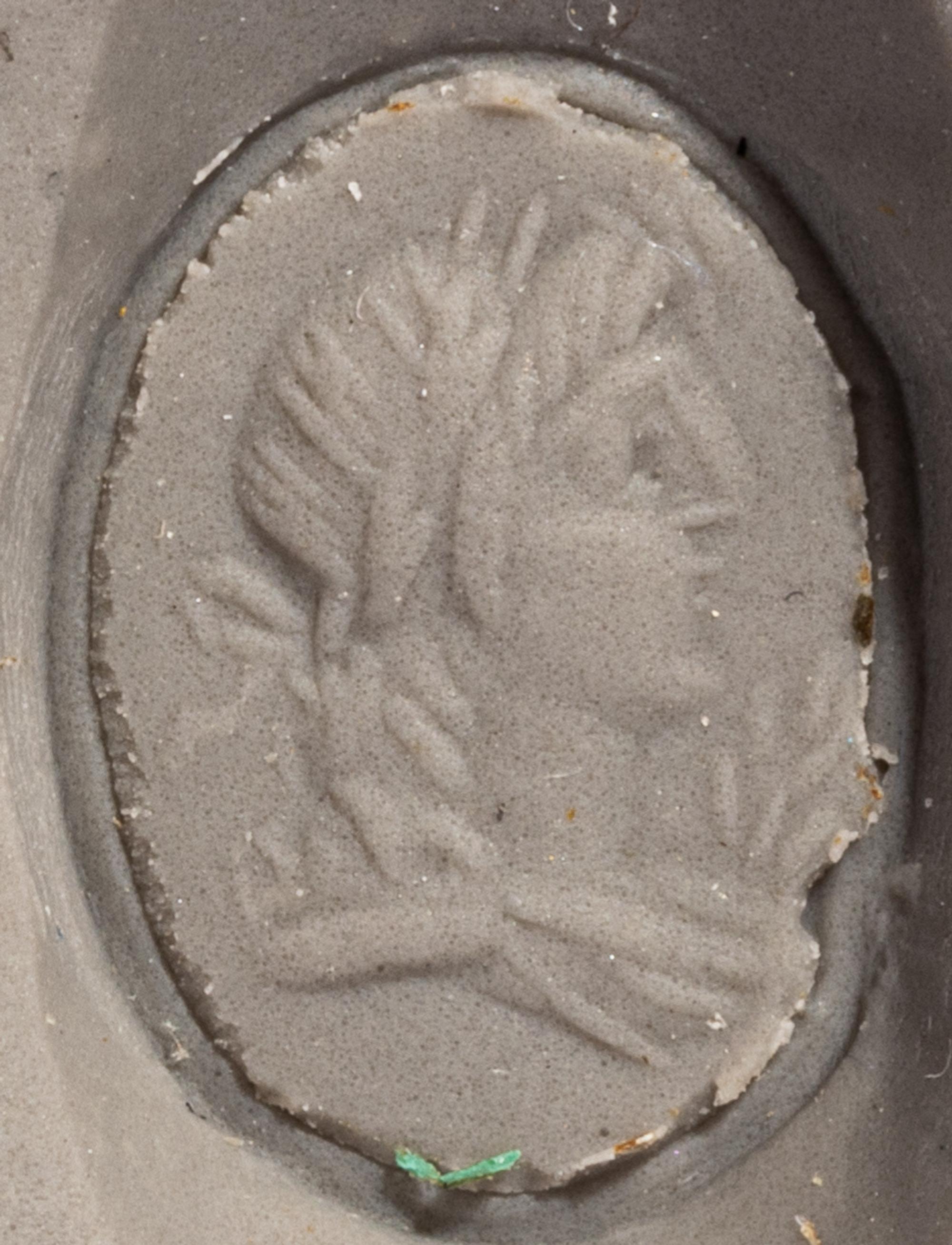 A Roman Gold and Carnelian Finger Ring with a Male Portrait Head