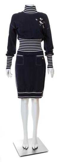 A Chanel Navy Three Piece Jacket and Skirt Ensemble, Jacket and skirt size 42, Top size 40.