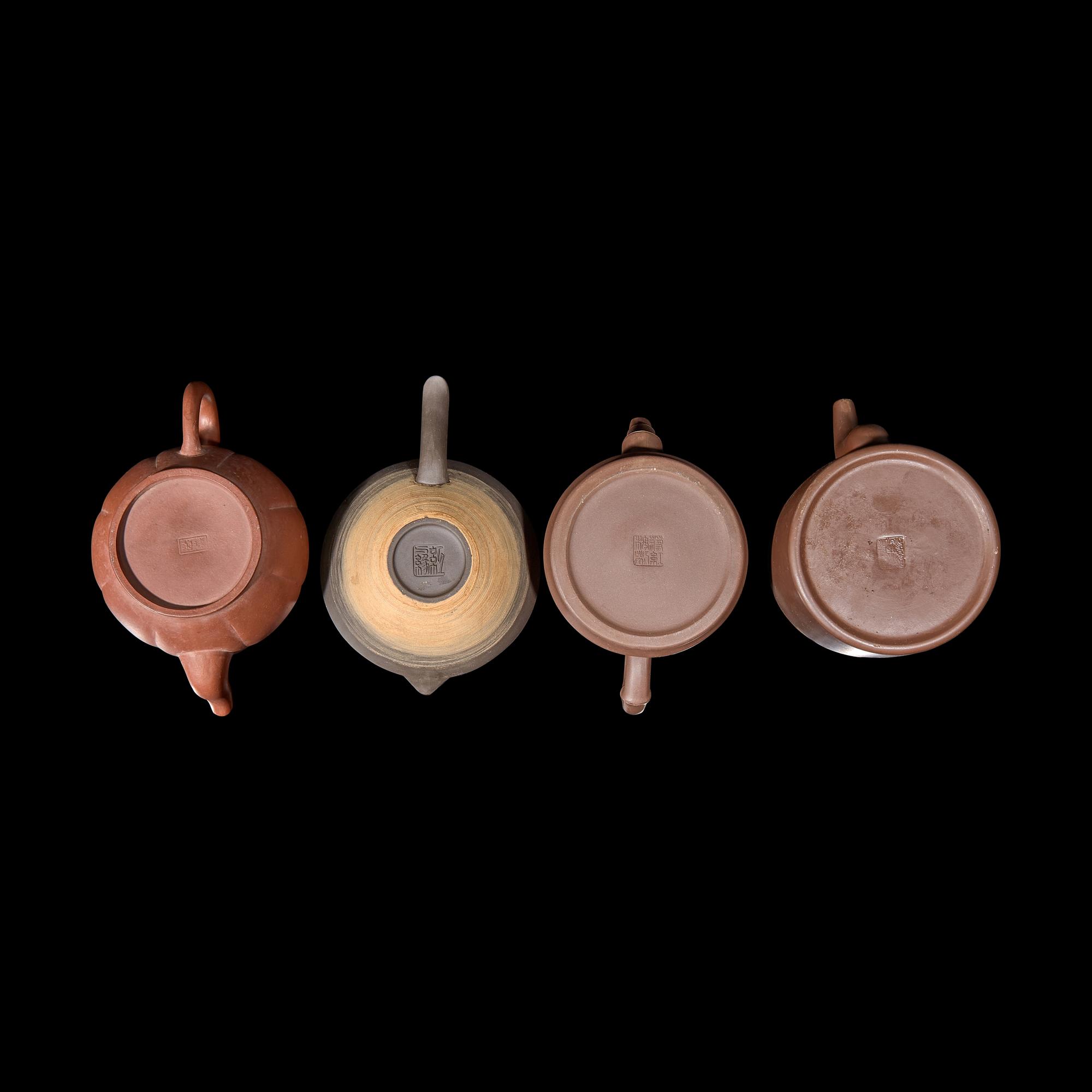 A Group of Eight Assorted Yixing Zisha Stoneware Teapots 宜興紫砂茶壺八件