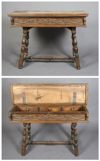 A Continental Carved Walnut Desk, Height 36 x width 48 1/2 x depth 25 3/4 inches.