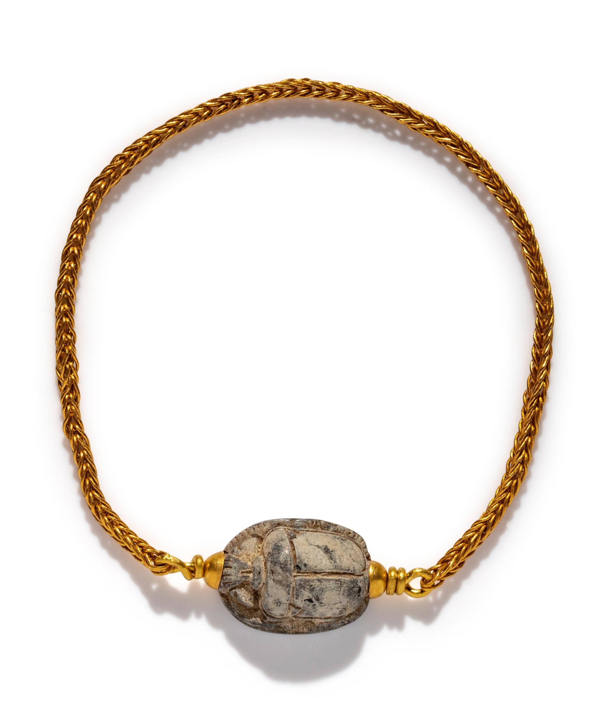 An Egyptian Steatite Scarab — Set in a gold bracelet
