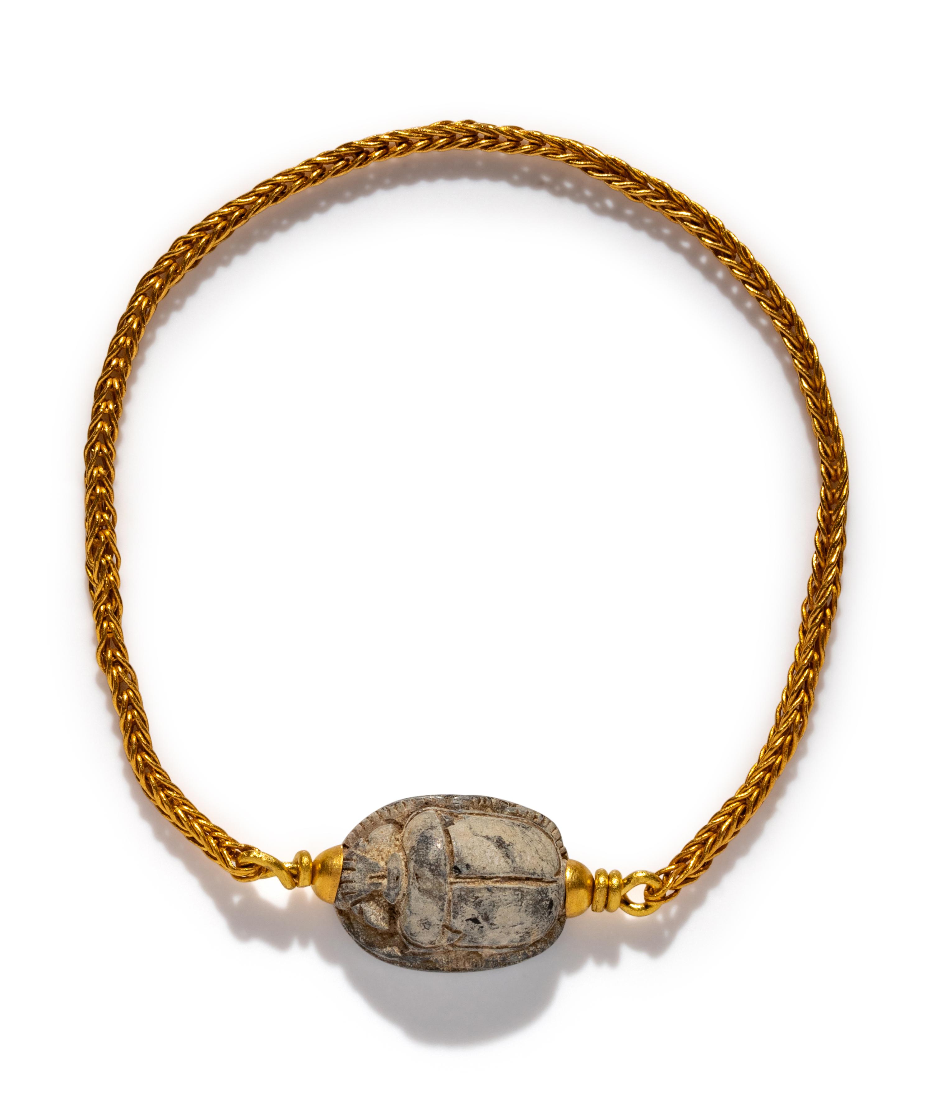 An Egyptian Steatite Scarab — Set in a gold bracelet