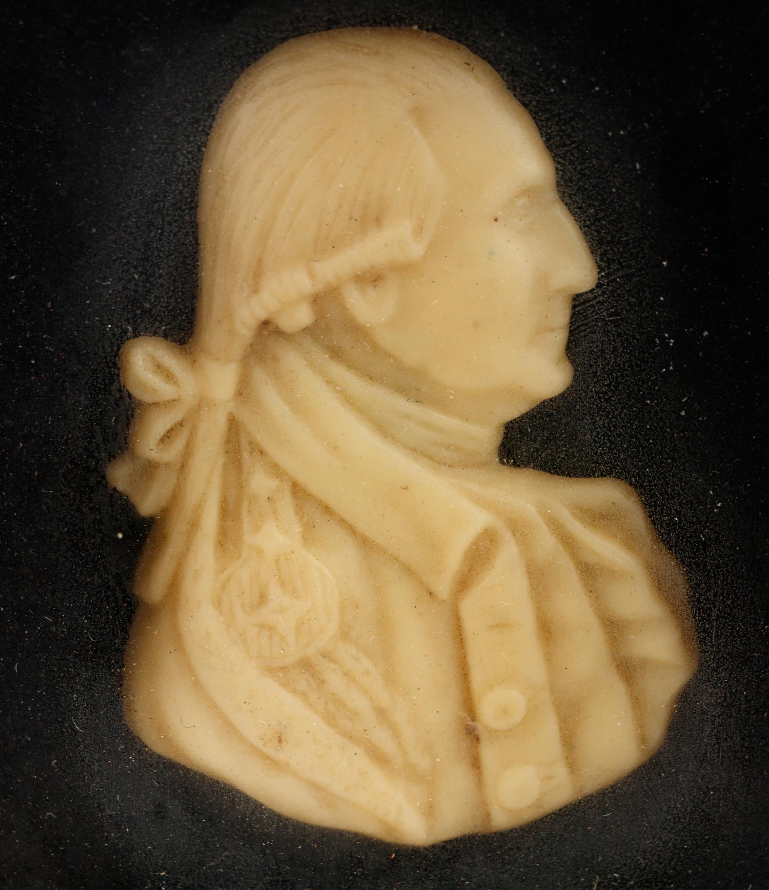 A Pair of Wax Portrait Busts of George and Martha Washington