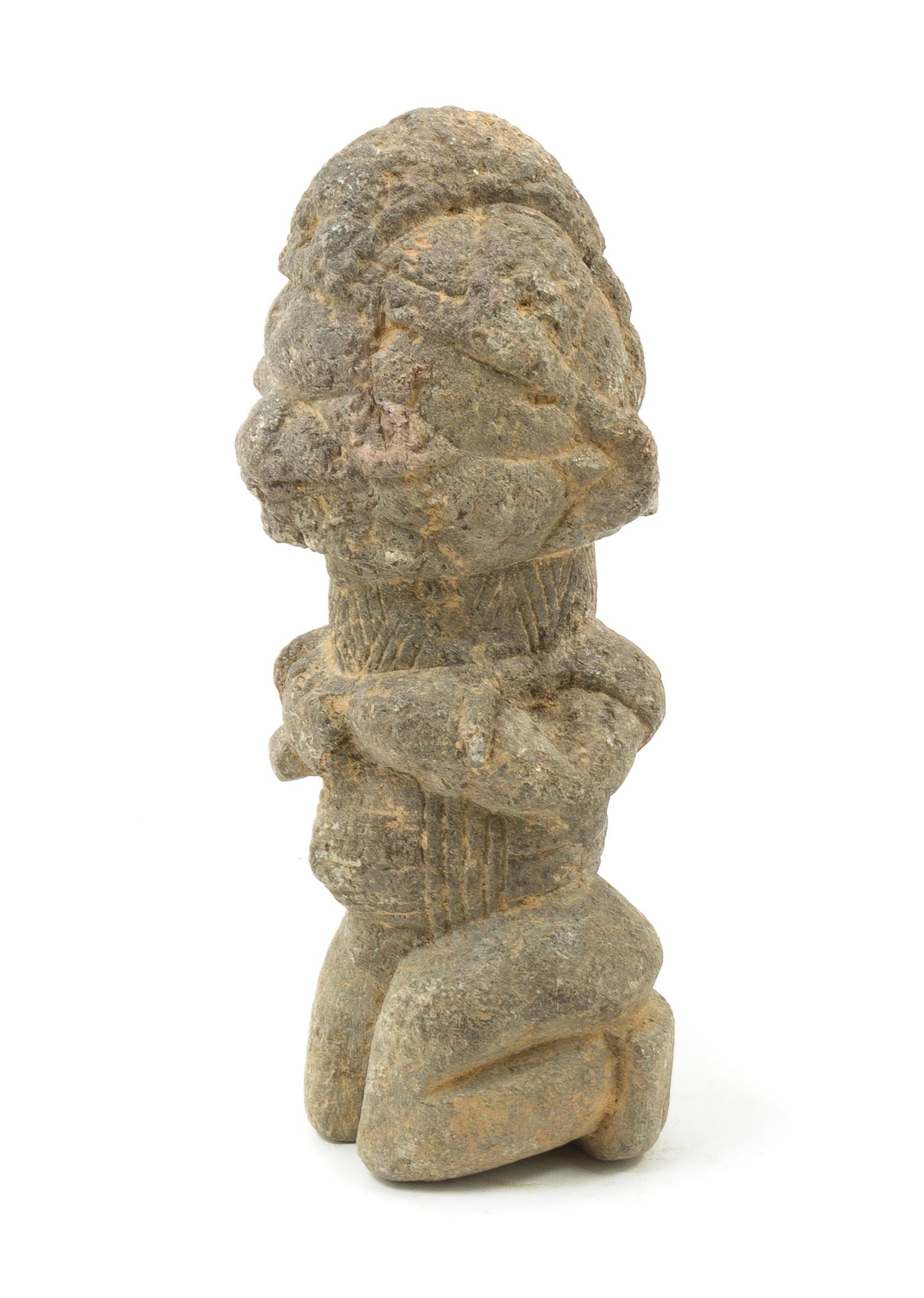 An African Kissi Stone Kneeling Figure Height 11 1/4 inches. — 19TH/20TH CENTURY