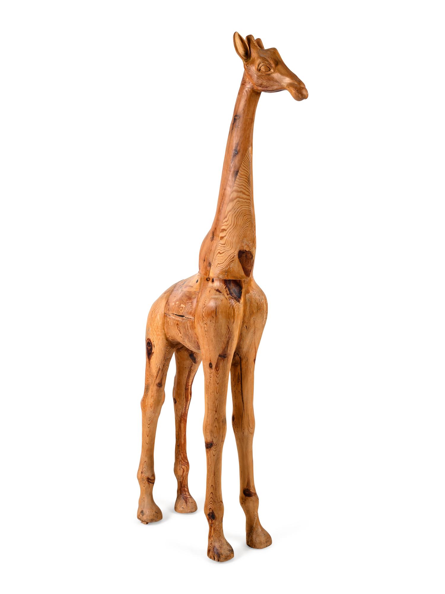 A Carved Pine Figure of a Giraffe