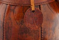 An Omersa & Co. Leather ‘Puppy’ Foot Stool