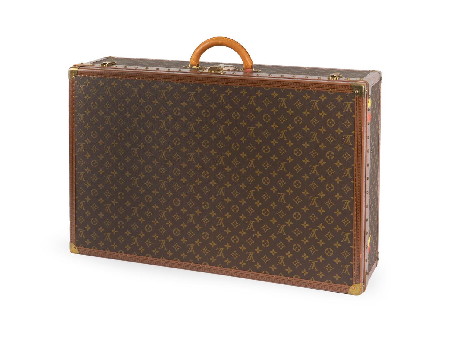 A Louis Vuitton Monogram Canvas Hardside Suitcase. — 20TH CENTURY