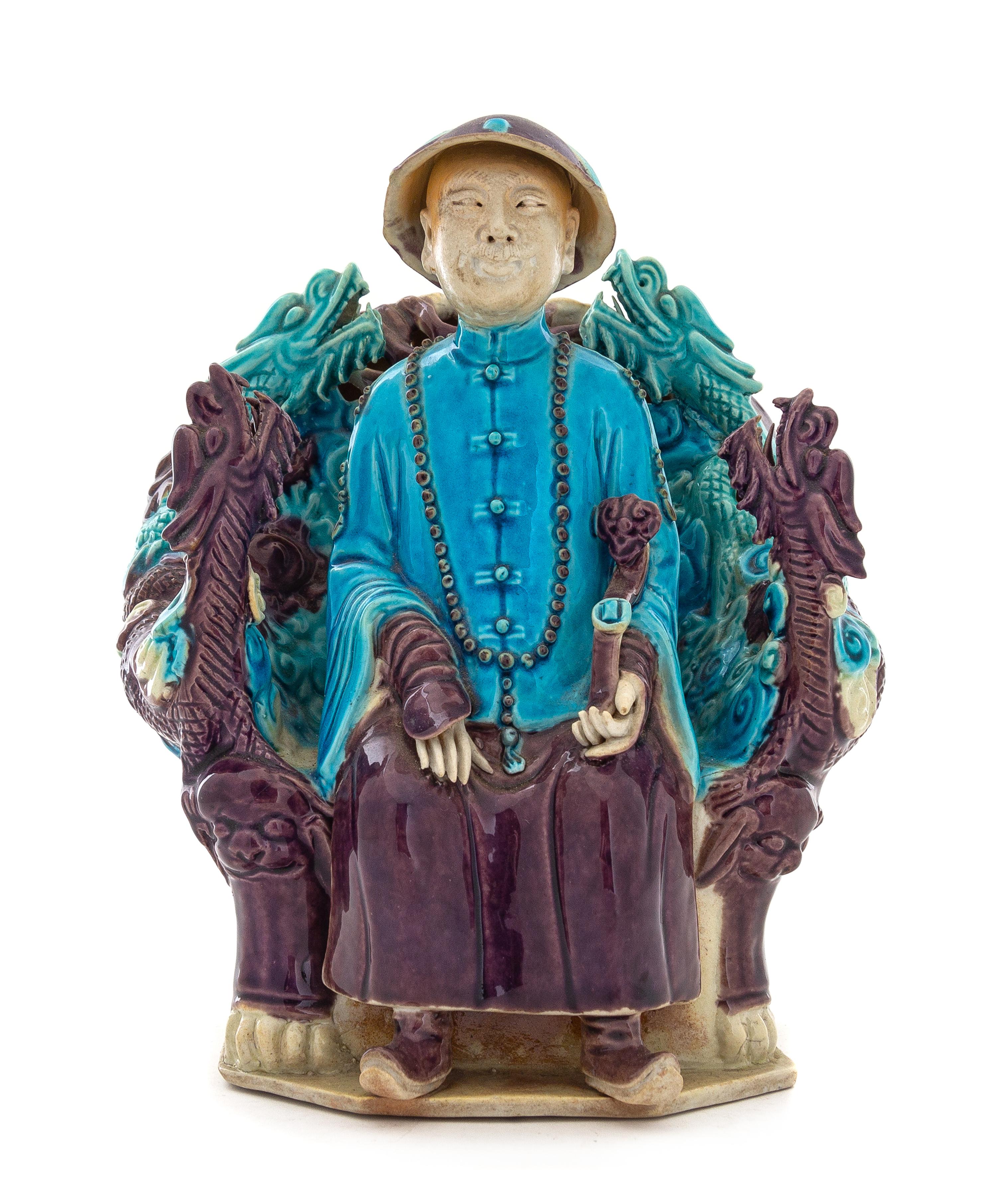 A Turquoise Aubergine Glazed Porcelain Figure of an Official Height 9 1/4 inches. — 19TH CENTURY