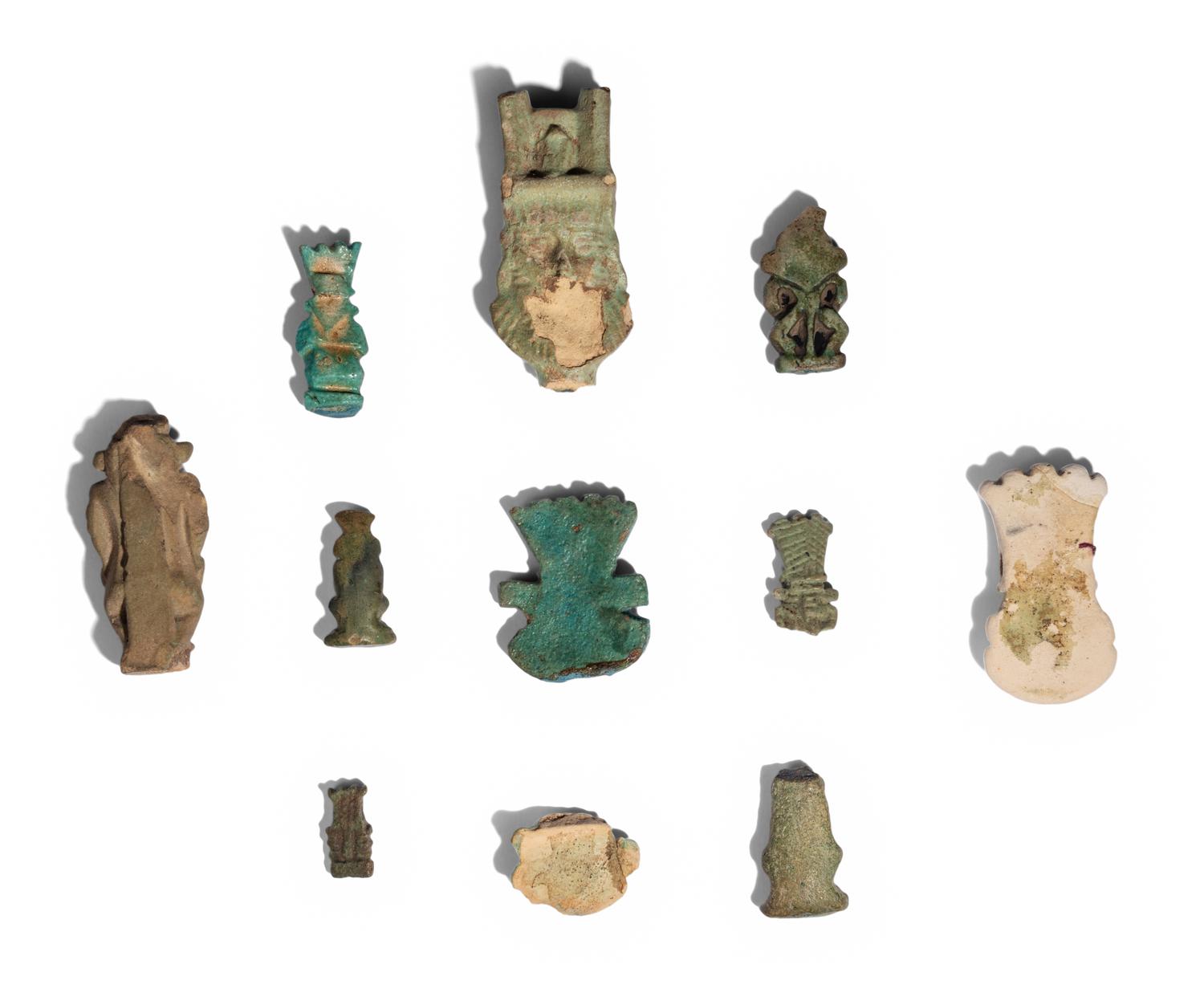 Eleven Egyptian Faience and Terracotta Bes Figures and Amulets