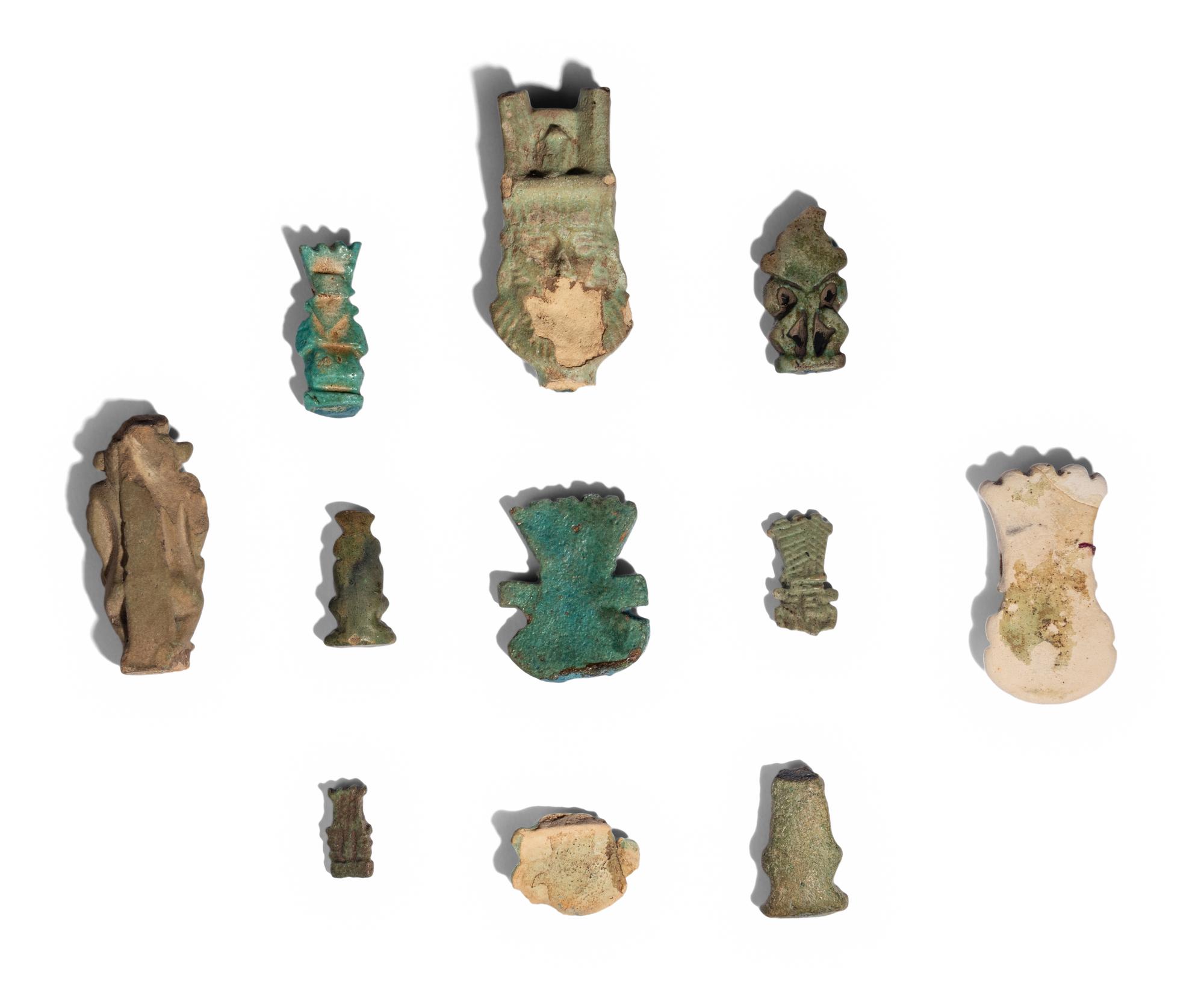 Eleven Egyptian Faience and Terracotta Bes Figures and Amulets