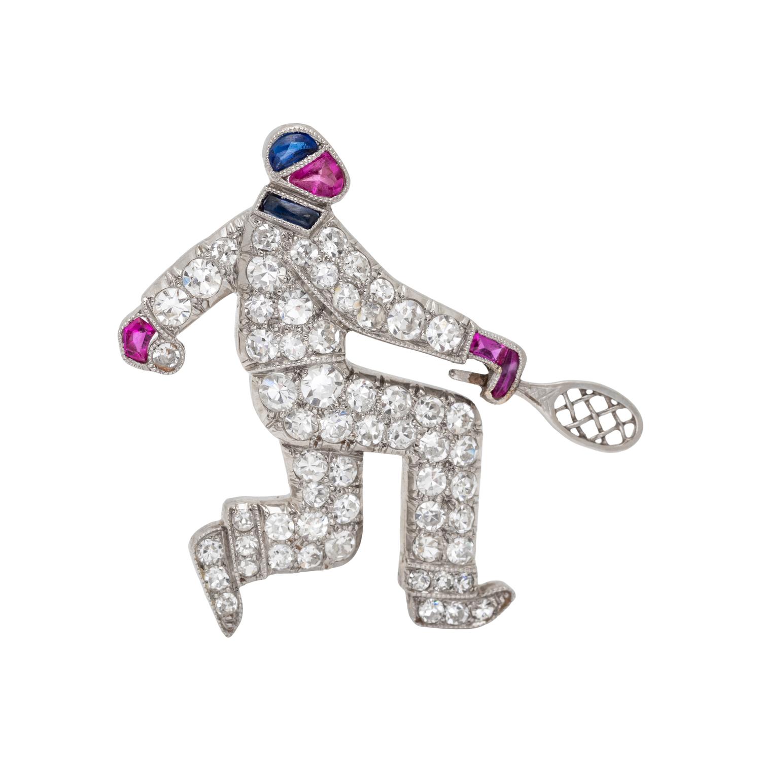 AUSTRIAN, ART DECO, DIAMOND, RUBY AND SAPPHIRE TENNIS PLAYER BROOCH