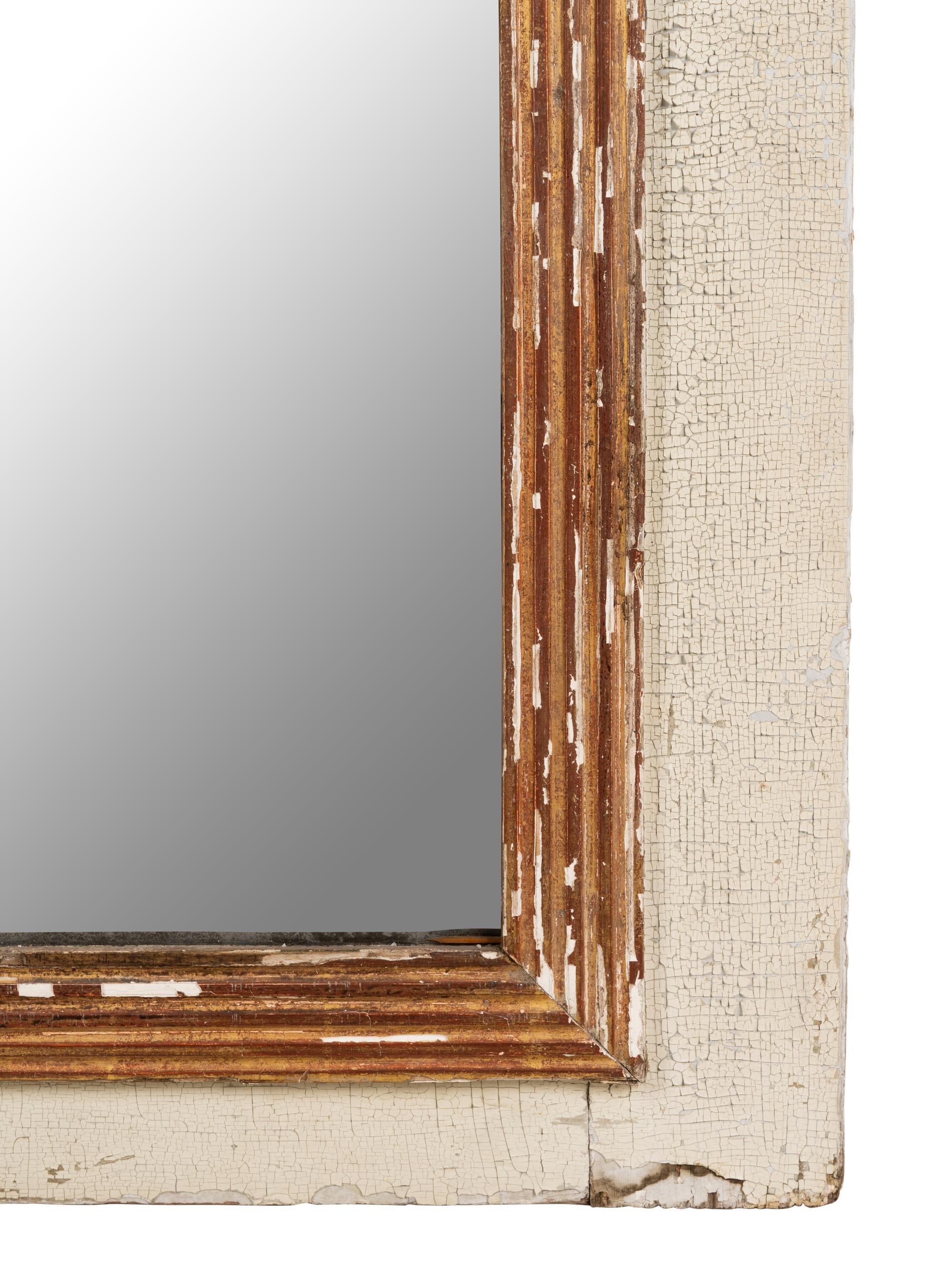 An Empire Style Painted and Parcel Gilt Mirror