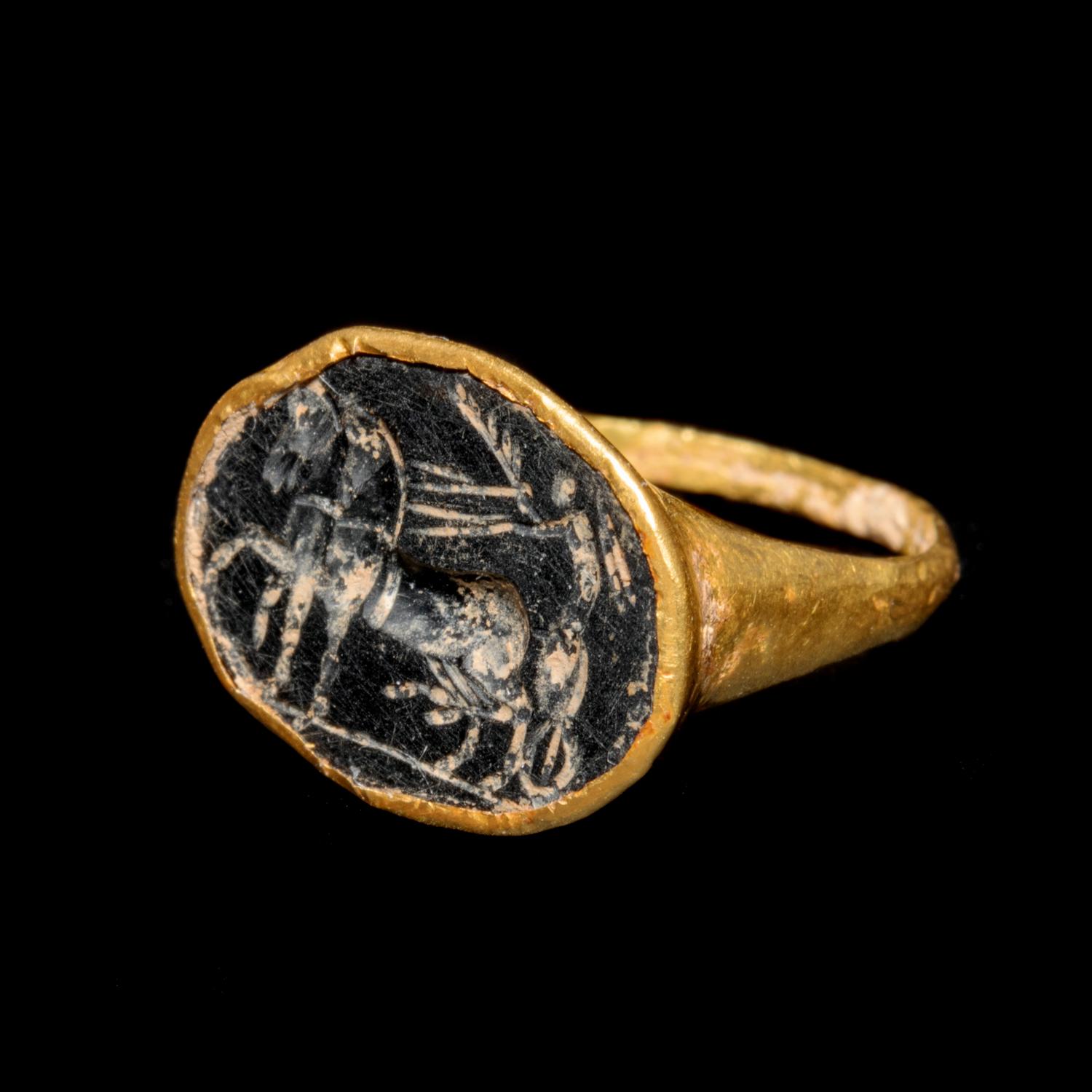 A Roman Gold Finger Ring with an Intaglio of Nike Riding a Chariot