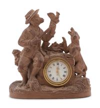 A Continental Terra Cotta Figural Clock