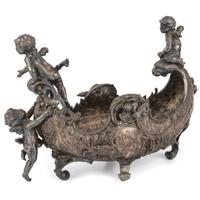An Ornate Silverplate Centerpiece Bowl of Boat Form with Cherubs