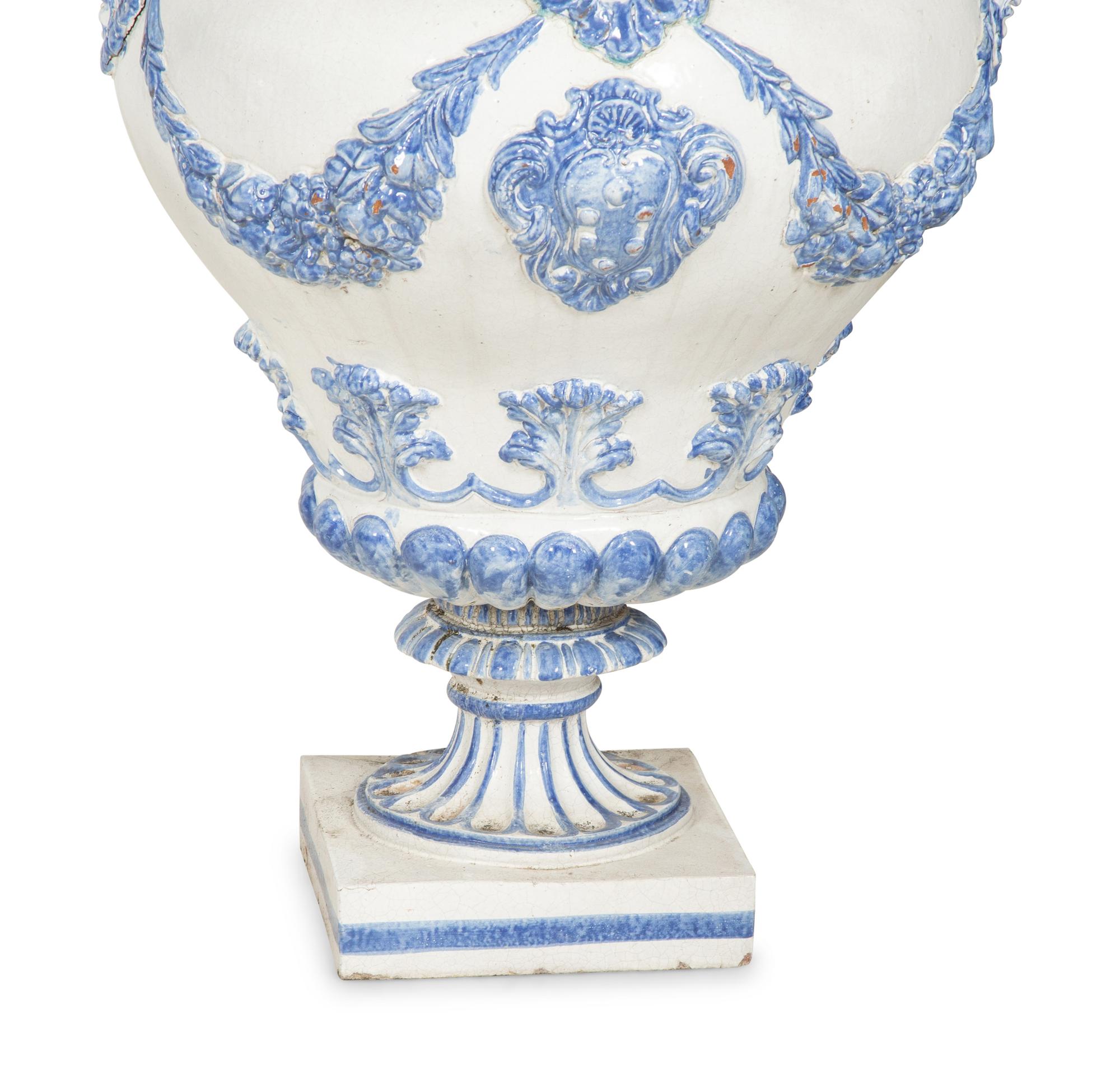 A Pair of Italian Blue and White Glazed Ceramic Covered Urns