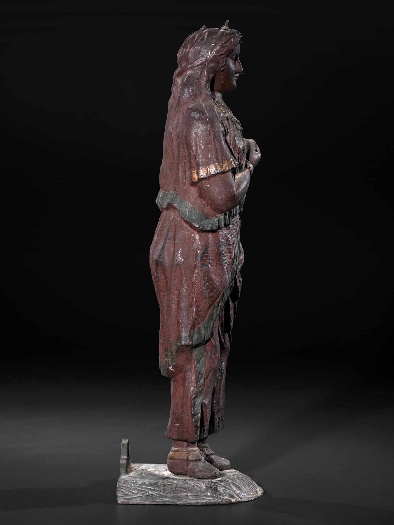 A Painted Cast Iron Tobacco Trade Figure of Native American Woman