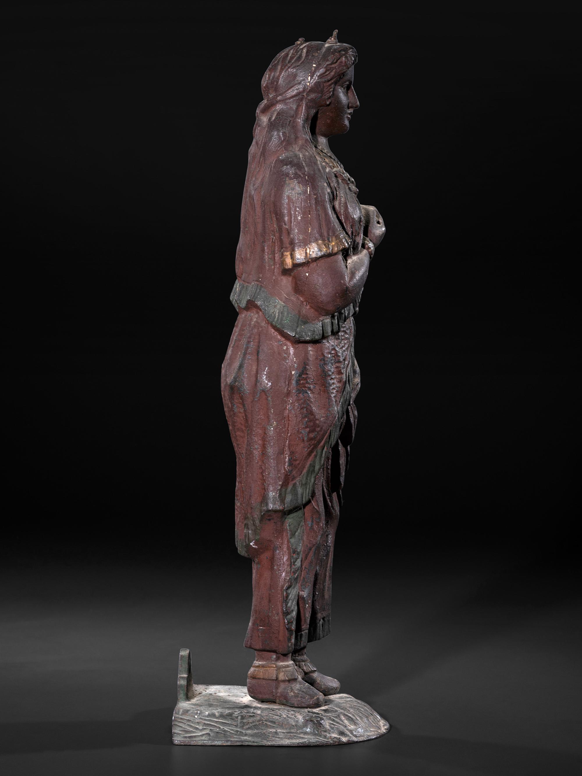 A Painted Cast Iron Tobacco Trade Figure of Native American Woman